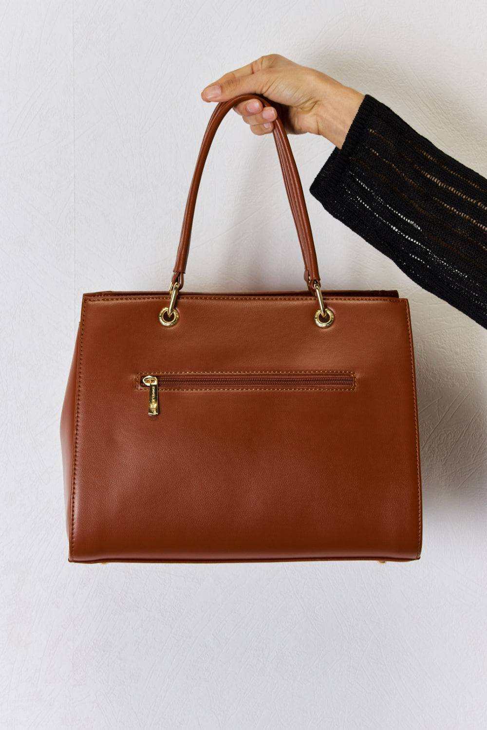 David Jones Texture PU Leather Handbag with sturdy handles and spacious interior.