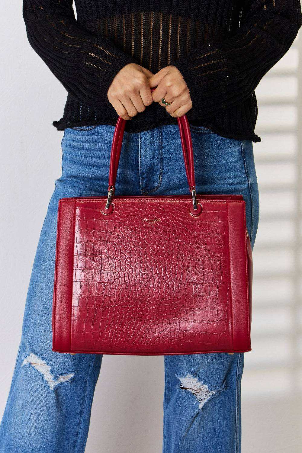 Red David Jones Texture PU Leather Handbag with sturdy handles and unique textured design.