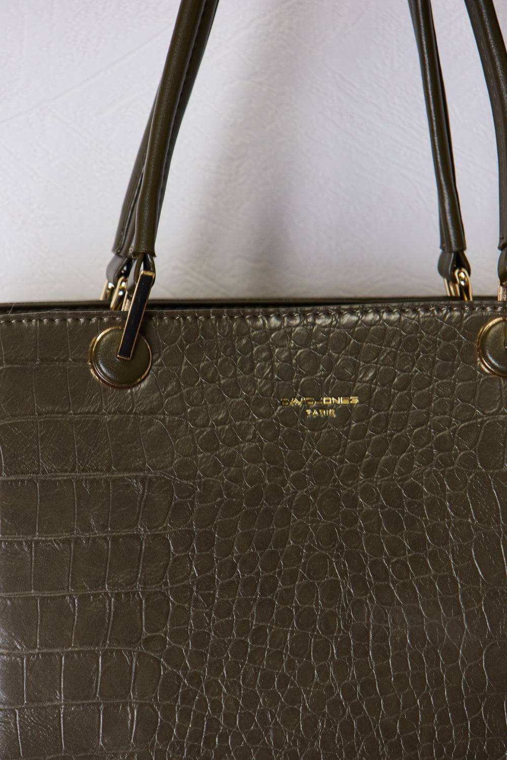 David Jones texture PU leather handbag with unique design and sturdy handles.